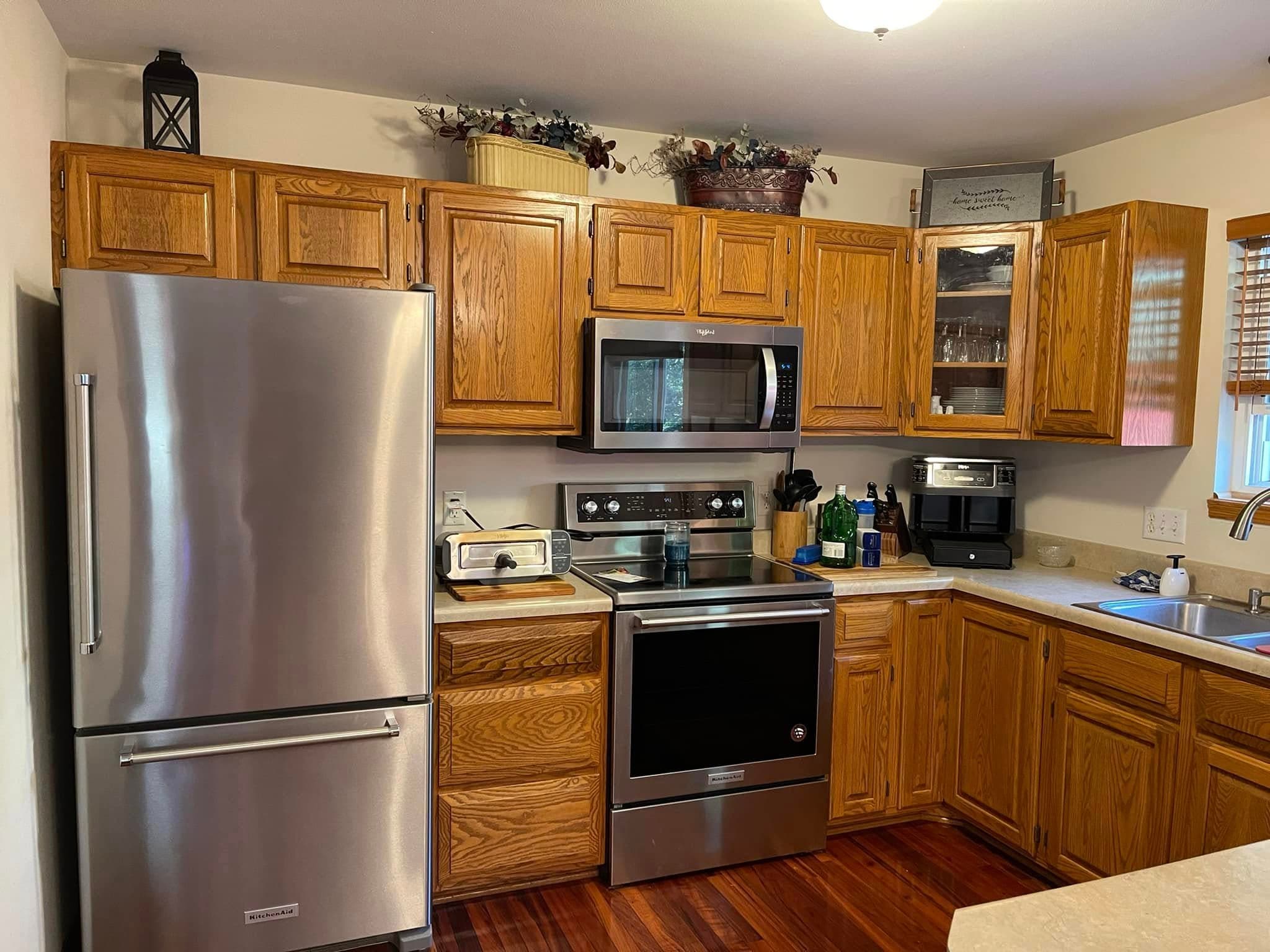 Kitchen cabinetry with a refreshed wood stain finish
