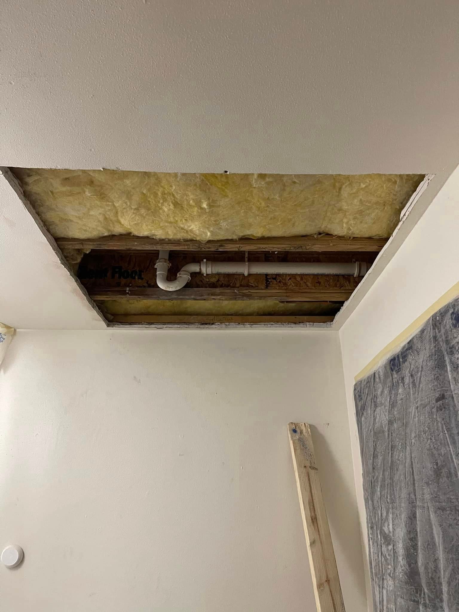 Ceiling section opened for drywall repair work